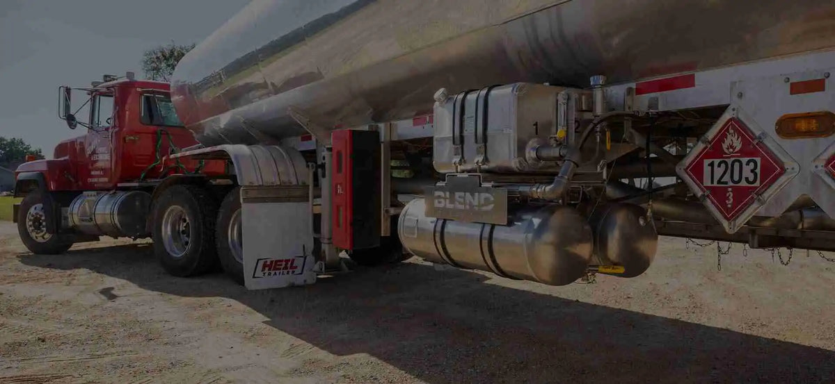 Tanker truck with a large cylindrical tank on a road