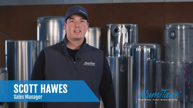 Scott Hawes, AlumiTank Sales Manager, standing in front of aluminum fuel tanks - Meet the Sales Team