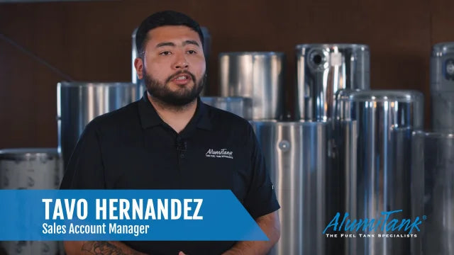 Tavo Hernandez, AlumiTank Sales Account Manager, standing in front of aluminum fuel tanks - Meet the Sales Team